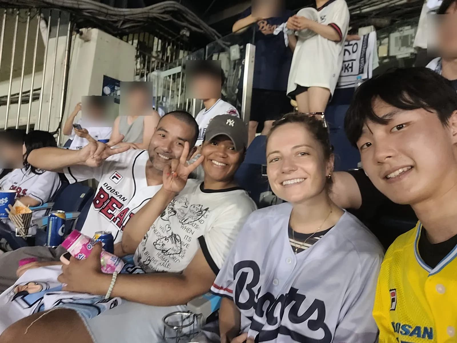 HanBuddy guests and buddies smiling together at a baseball game